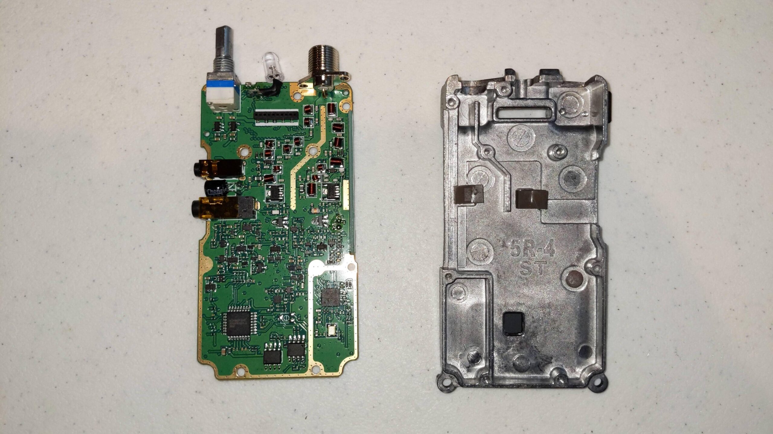 Baofeng UV5R internals, with PCB removed from backplate
