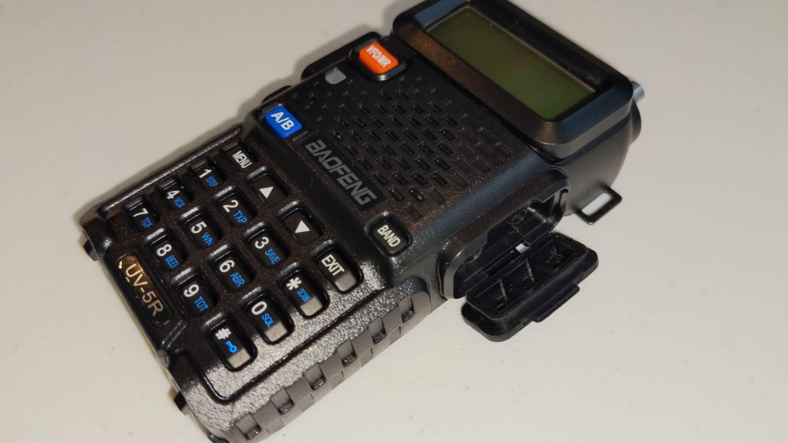 Baofeng UV5R with internals of radio separating from shell
